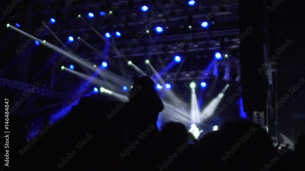 Excited people actively applauding, cheering their favorite singers on big stage Excited people actively applauding, cheering their favorite singers on big stage