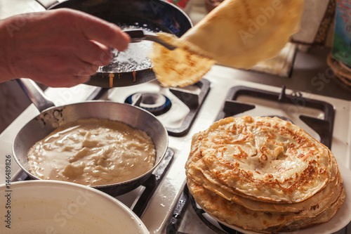 Grandmother making pancakes