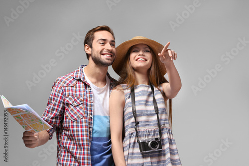 Couple of travelers with ma...