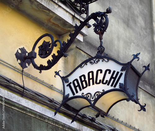 old ornate deco italian tobacconist sign tabacchi = tobacco photo