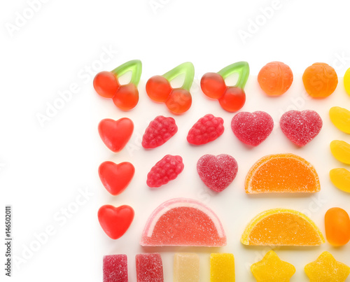 Composition of colorful jelly candies on white background
