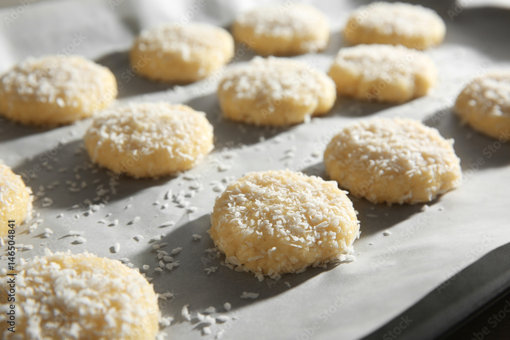 Baking tray with coconut cookies, closeup