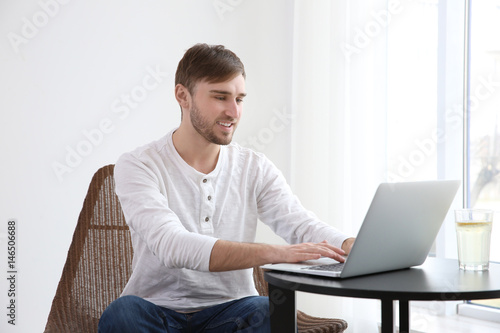 Handsome young man working ...