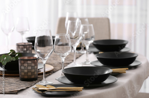 Table with beautiful setting in restaurant, closeup