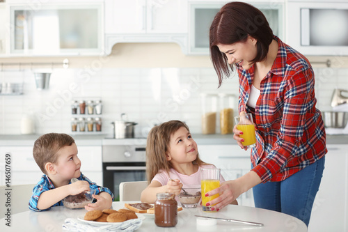 Mother and children having ...