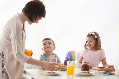 Mother and children having ...