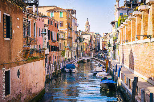 Classic postcard view of a colorful canal in Venice, Italy
