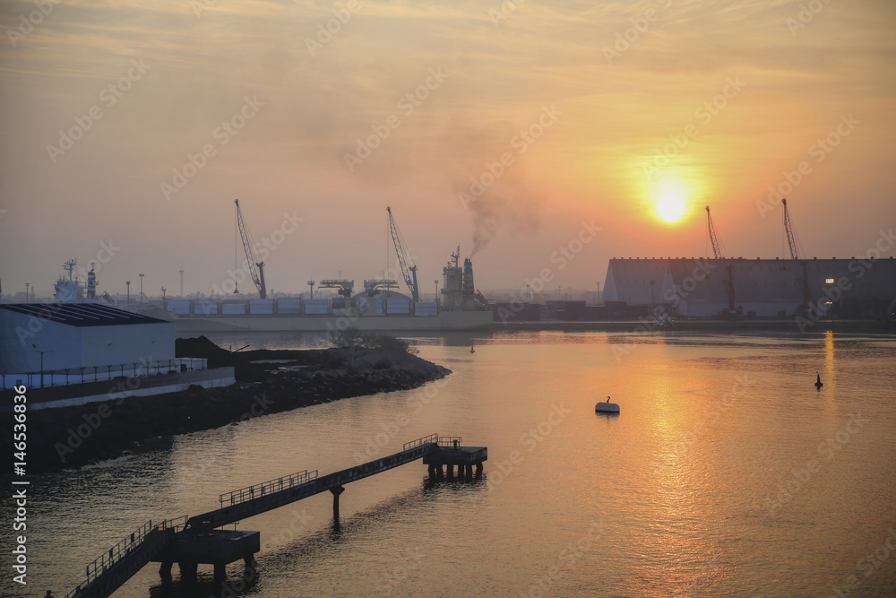 Sunrise over port terminal