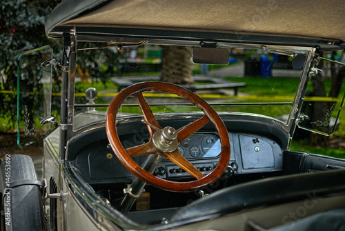 Wooden Steering wheel of a classic vintage car.