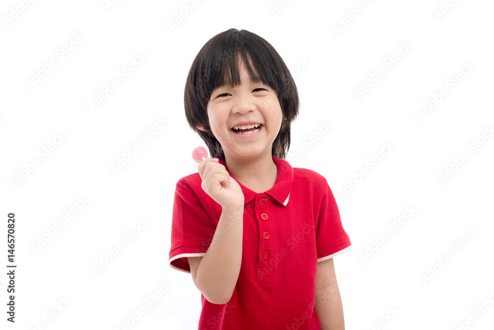Asian child eating a lollipop on white background Asian child eating a lollipop on white background