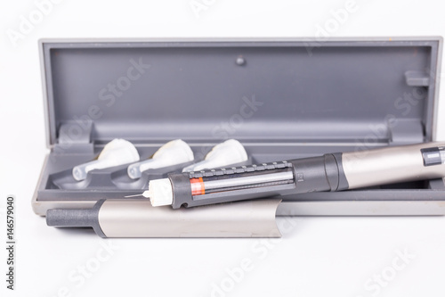 Insulin pen with hard case on white background