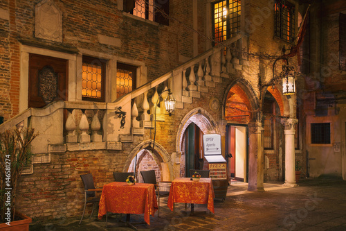 Fototapeta Naklejka Na Ścianę i Meble -  The picturesque restaurant in the evening light in Venice, Italy