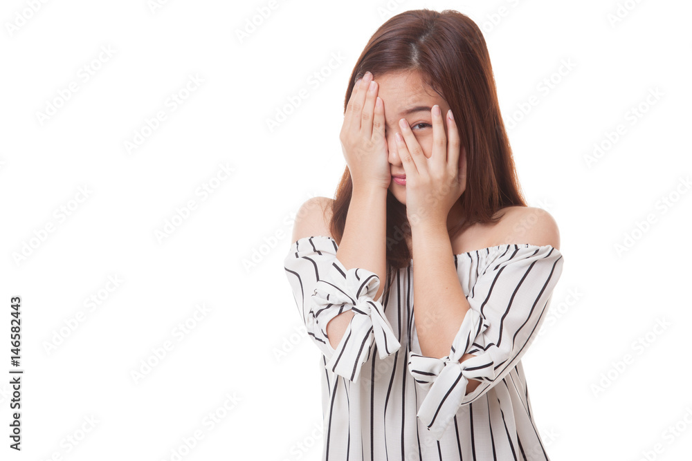 Beautiful young Asian woman peeking through fingers. Beautiful young Asian woman peeking through fingers.