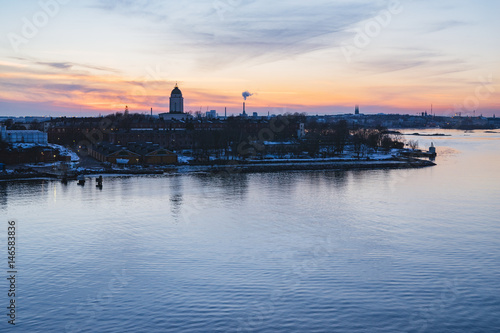 Wonderful sunset over fortress Suomenlinna and Helsinki city