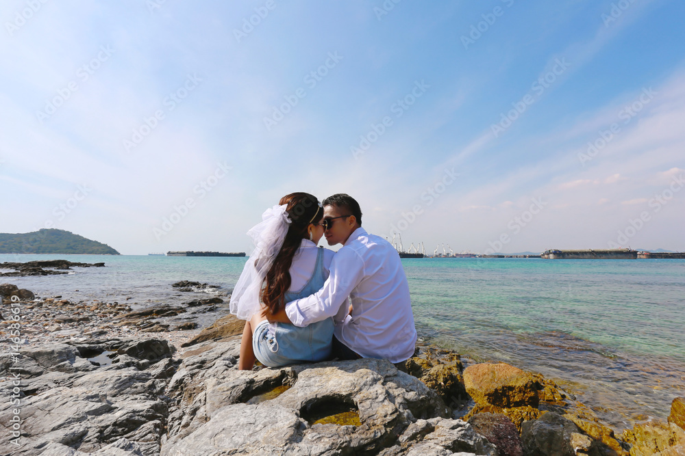 Pre Wedding photo of romantic Thai couple on seaside.