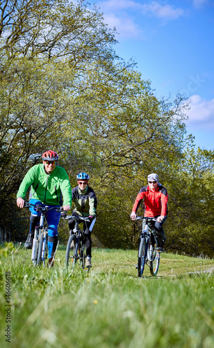 Walking a bike through the forest in the spring.