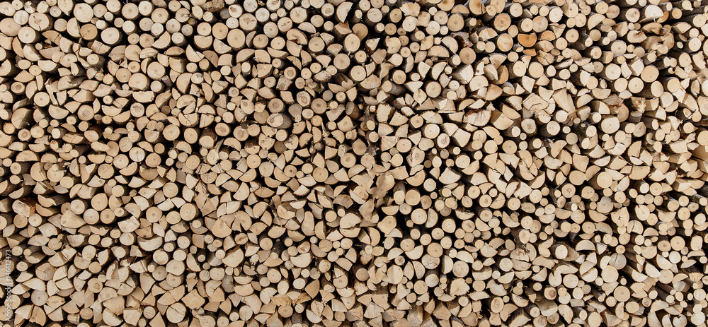 Natural wooden background, many chopped firewood. Natural wooden background, many chopped firewood.