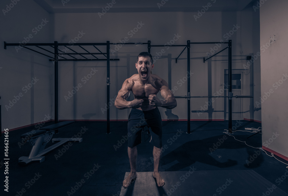Fototapeta premium one young man, bodybuilder screaming shouting