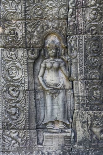 Khmer devata guarding the temple shown in stone in Banteay Kdei temple in Angkor, Siem Reap, Cambodia. © Alexey Pelikh