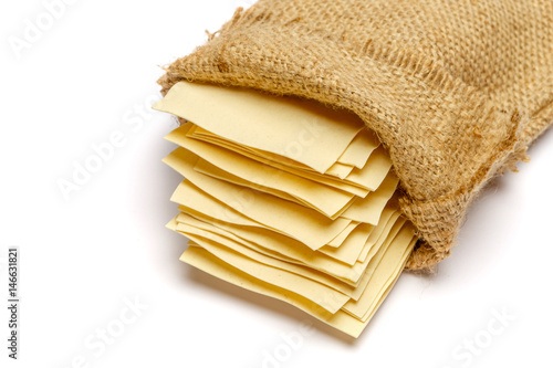 dried uncooked lasagna pasta sheets in bag