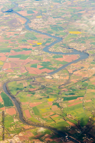 Long curved river with many bridges view from sky. Aerial view land