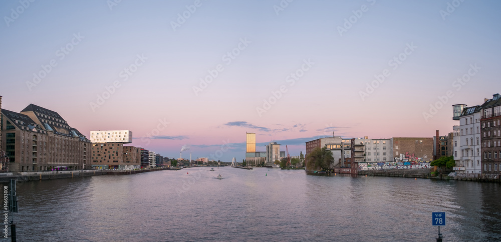 Berlin skyline -  river spree panorama, boats and sunset sky