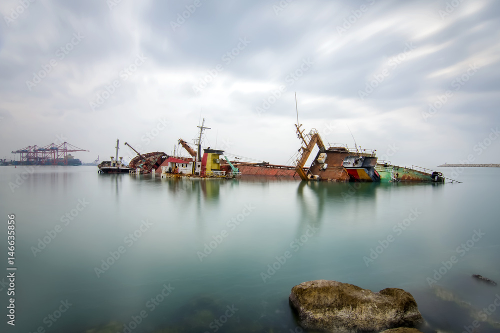 A sunken wreck rusting into the sea A sunken wreck rusting into the sea