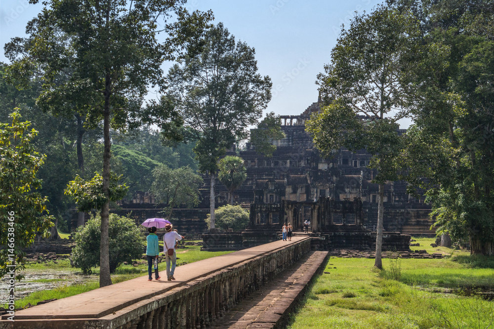 People are walking to Baphuon Temple, Siem Reap, Cambodia