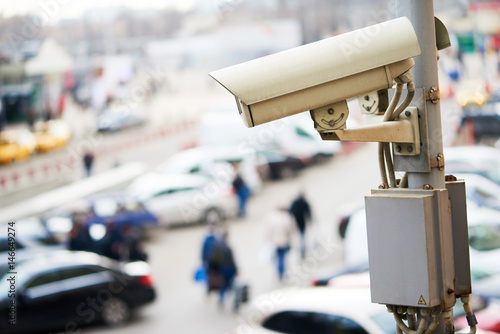 Urban safety and security. CCTV camera or surveillance operating in city