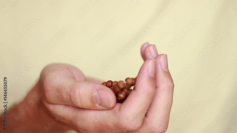 Getting muslim beads in hand Getting muslim beads in hand