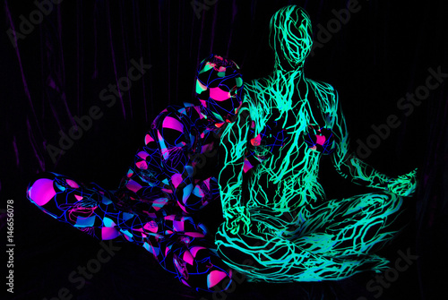 uv dancers in the nightclub wearing zentai catsuits photo