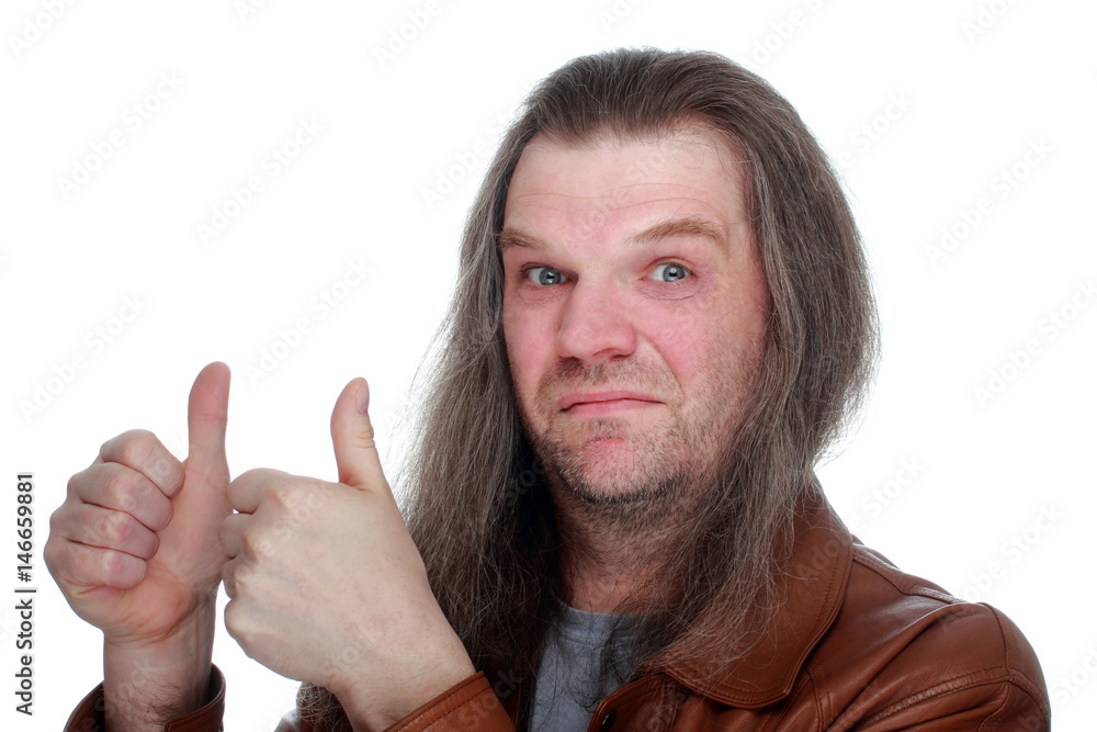 An adult man with long hair shows likes, makes faces. An adult man with long hair shows likes, makes faces.