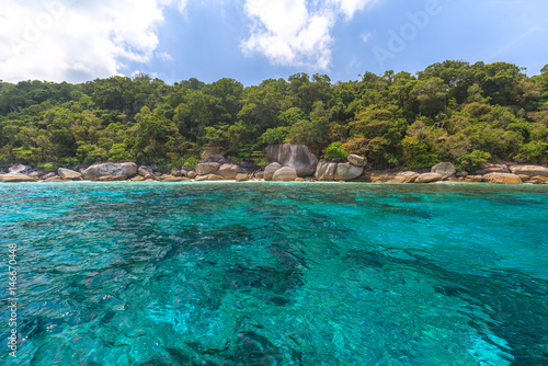 Tropical island beach and clear blue lagoon water with blue sky at Similan Island, Phang Nga Province, South of Thailand 