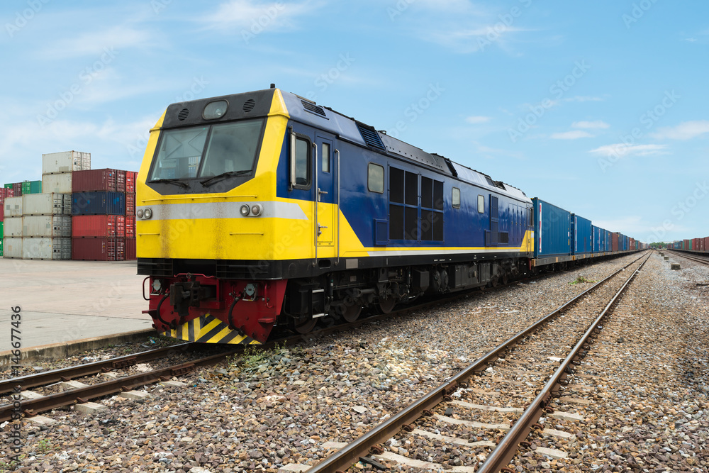 Cargo train platform with freight train container at depot use for Import, Export, Logistics background. Import, Export, Logistics concept. Cargo train platform with freight train container at depot use for Import, Export, Logistics background. Import, Export, Logistics concept.