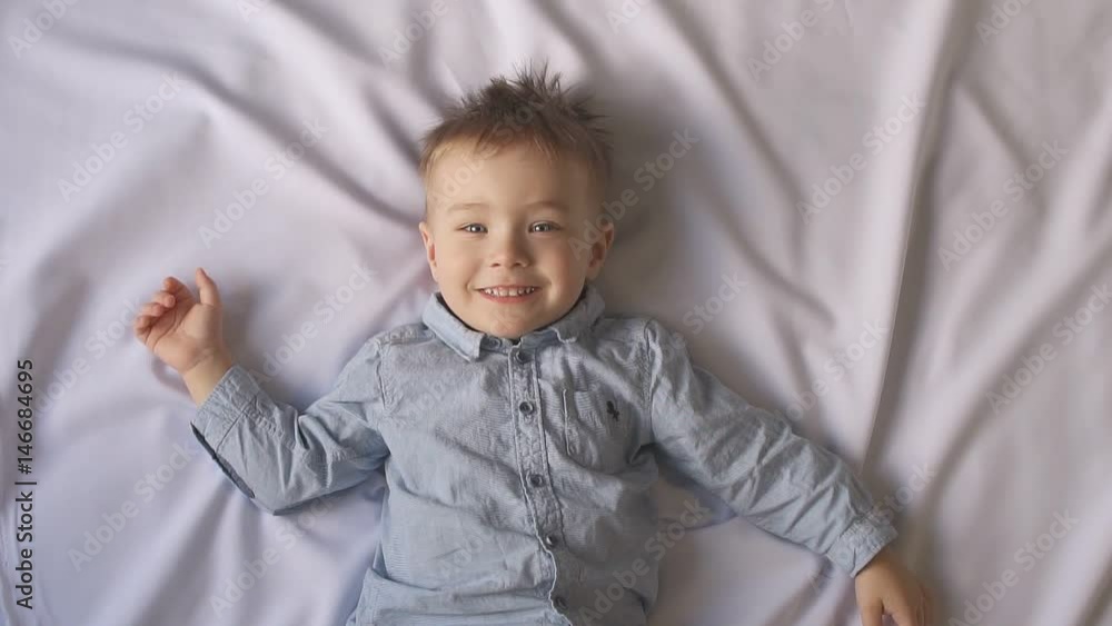 Beautiful little baby on a white background, Slow motion Beautiful little baby on a white background, Slow motion