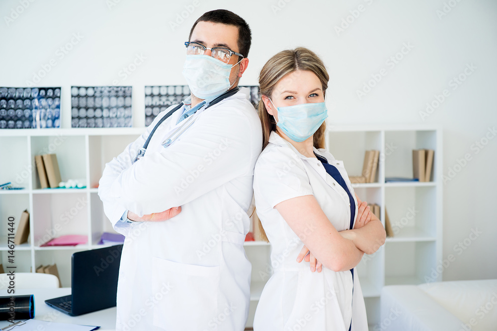 Portrait of two doctors in masks Portrait of two doctors in masks