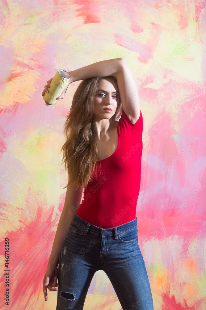 Fototapeta premium Pretty girl or beautiful painter with spray paint bottle