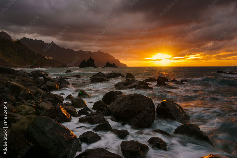 Dynamic and dramatic sunset over Benijo beach in Tenerife