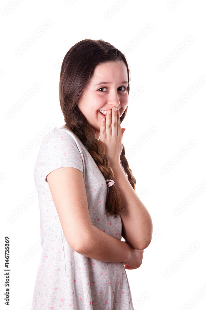 Young teenager girl giggling with her arm in front of mouth over the white background Young teenager girl giggling with her arm in front of mouth over the white background