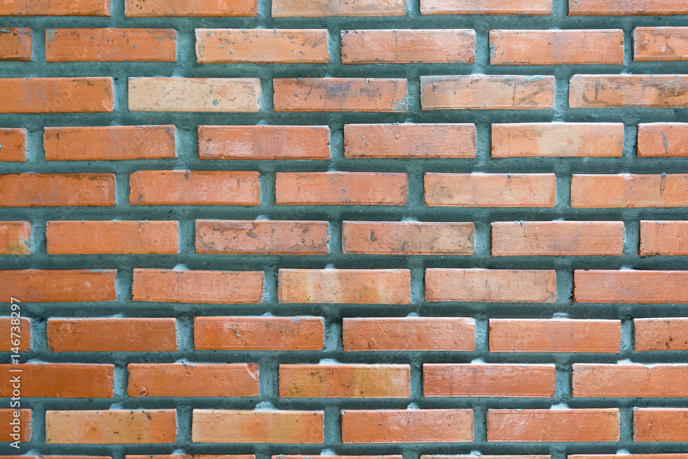 Orange brick wall background with cement concrete, pattern Orange brick wall background with cement concrete, pattern
