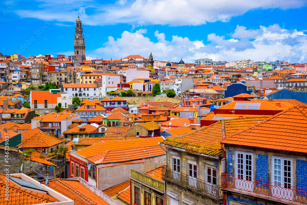 Beautiful view of the colorful old town with famous Porto landmark; Clerigos tower (Torre dos Clerigos)