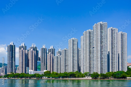 View of modern apartment buildings on the waterfront site with blue sky as a background and copy space © Zoegraphy
