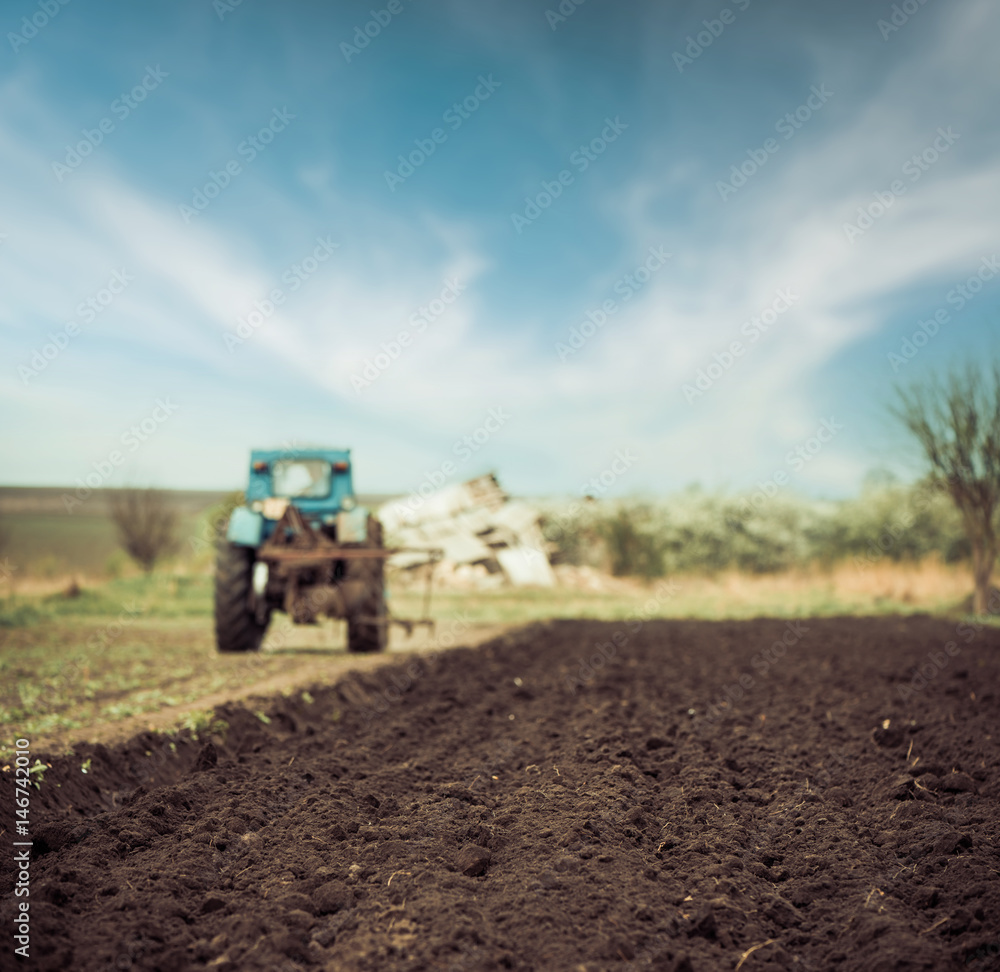 tractor on farm spring field tractor on farm spring field