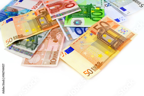 Pile of euro currency banknotes on white background
