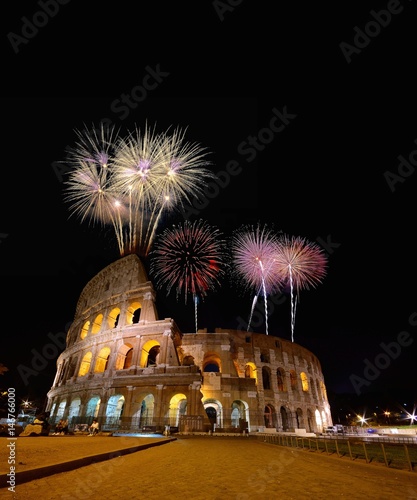 Colosseum illuminated with fireworks in Rome.