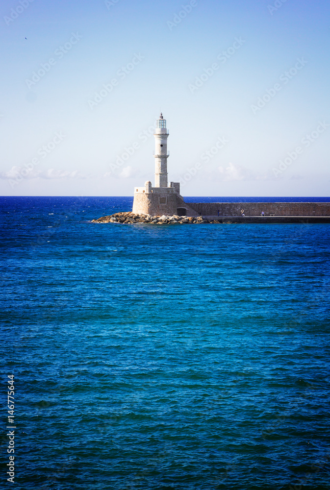 bay of Chania with Aegan sea and lighthouse at sunny summer day, Crete, Greecer, retro toned