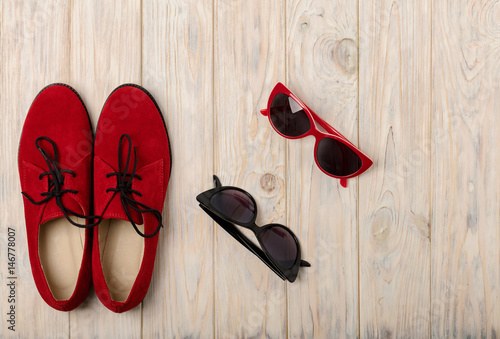 Red women shoes oxfords and sunglasses.