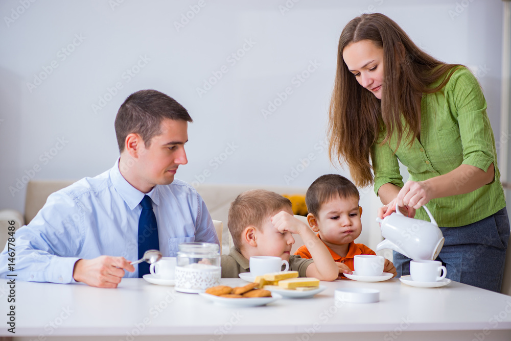Happy family having breakfast together at home Happy family having breakfast together at home