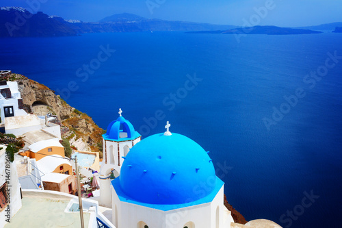 view of caldera with blue church domes  Oia  Santorinir  retro toned