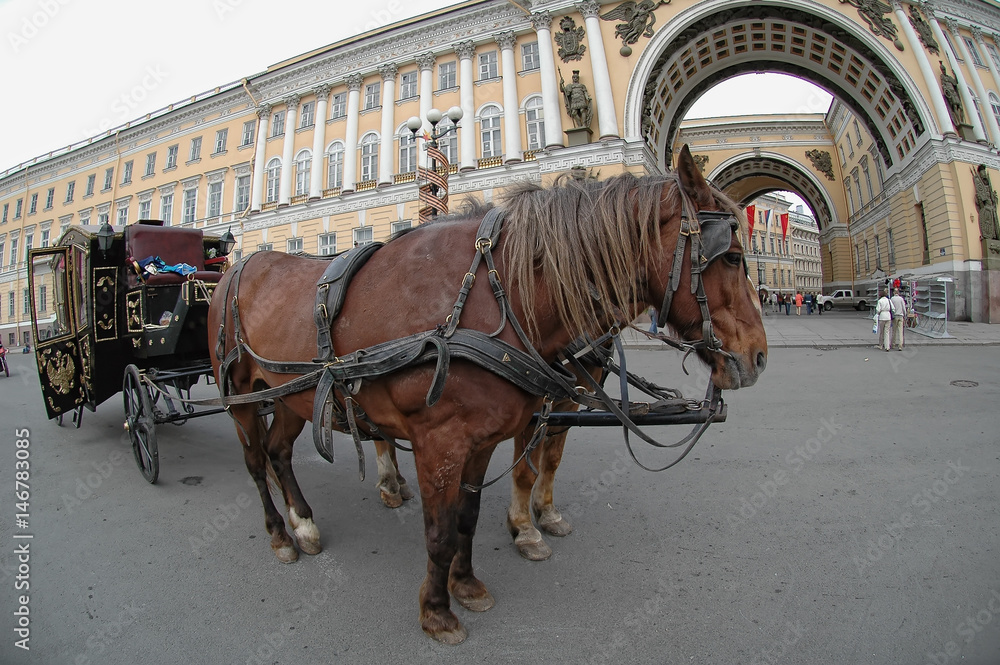 Saint-Petersburg, Russia - May 13, 2006: Crew with horses near Arch of General Staff Building and Hermitage Saint-Petersburg, Russia - May 13, 2006: Crew with horses near Arch of General Staff Building and Hermitage